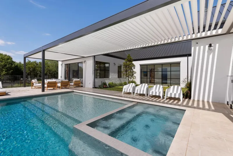 Closed louvre pergola providing full weather protection — Campbelltown, NSW