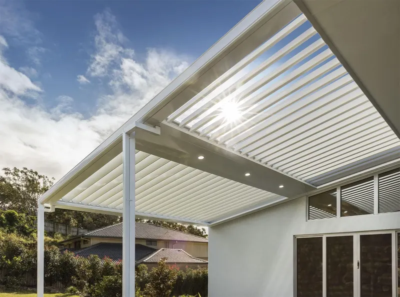 Custom powder-coated pergola over an outdoor kitchen — Cronulla, NSW