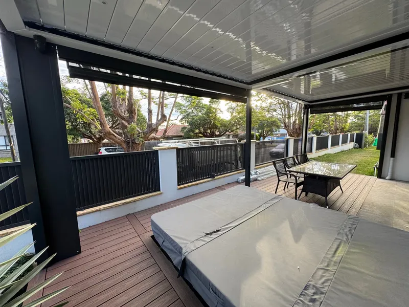 Louvre pergola with blades angled for afternoon shade — Camden, NSW