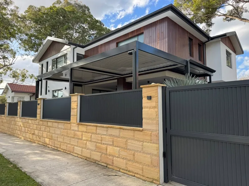 Motorised opening louvre pergola over a poolside alfresco — Liverpool, NSW