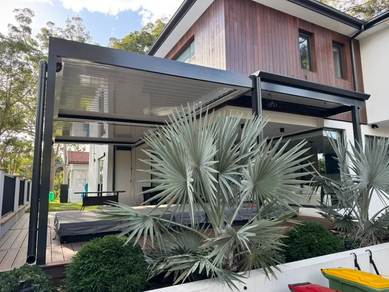 Louvre pergola with the blades open for sun and breeze — Narellan, NSW