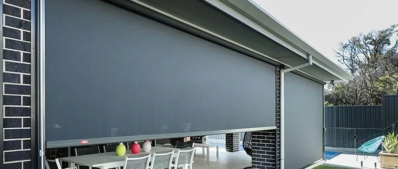 Outdoor café blinds with a clear view to the garden — Shellharbour, NSW