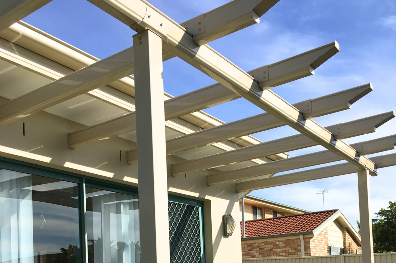 Open-rafter pergola attached over rear glass doors — Gymea, NSW