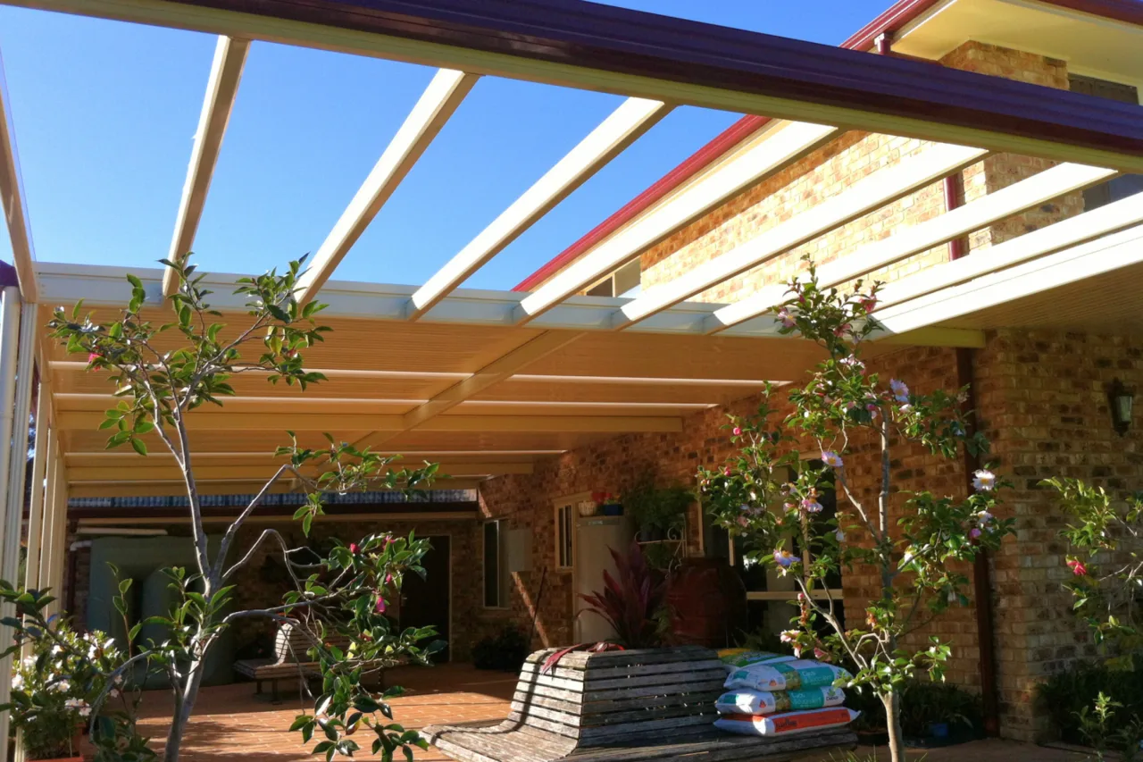 Flat-roof pergola over a brick courtyard garden — Campbelltown, NSW