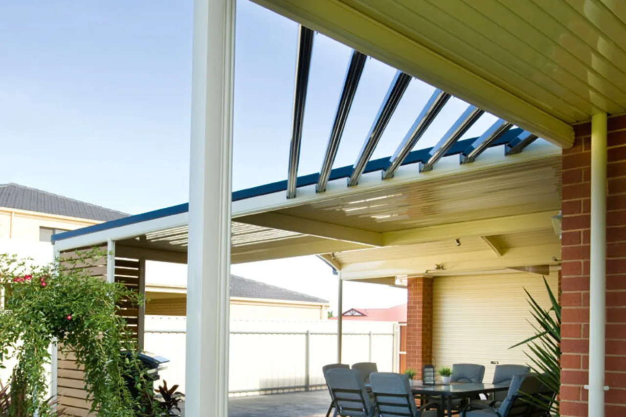 Aluminium skillion pergola shading a paved alfresco dining area — Liverpool, NSW